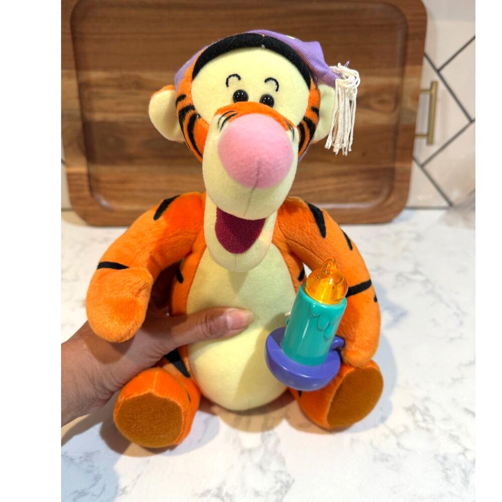 Vintage 90s Mattel Disney Winnie the Pooh Tigger plush holding a light-up candle